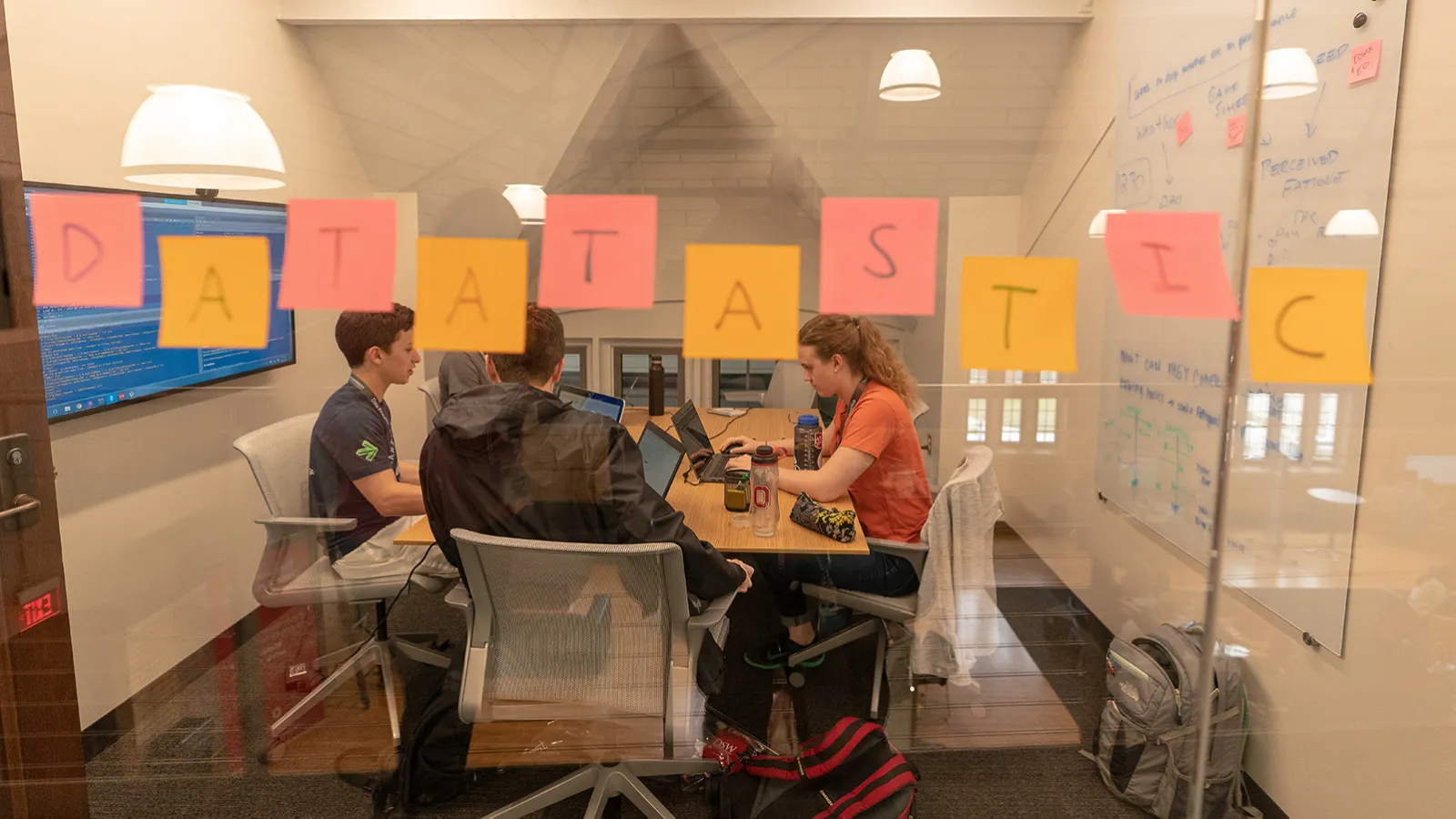 DataFest team working in a huddle room