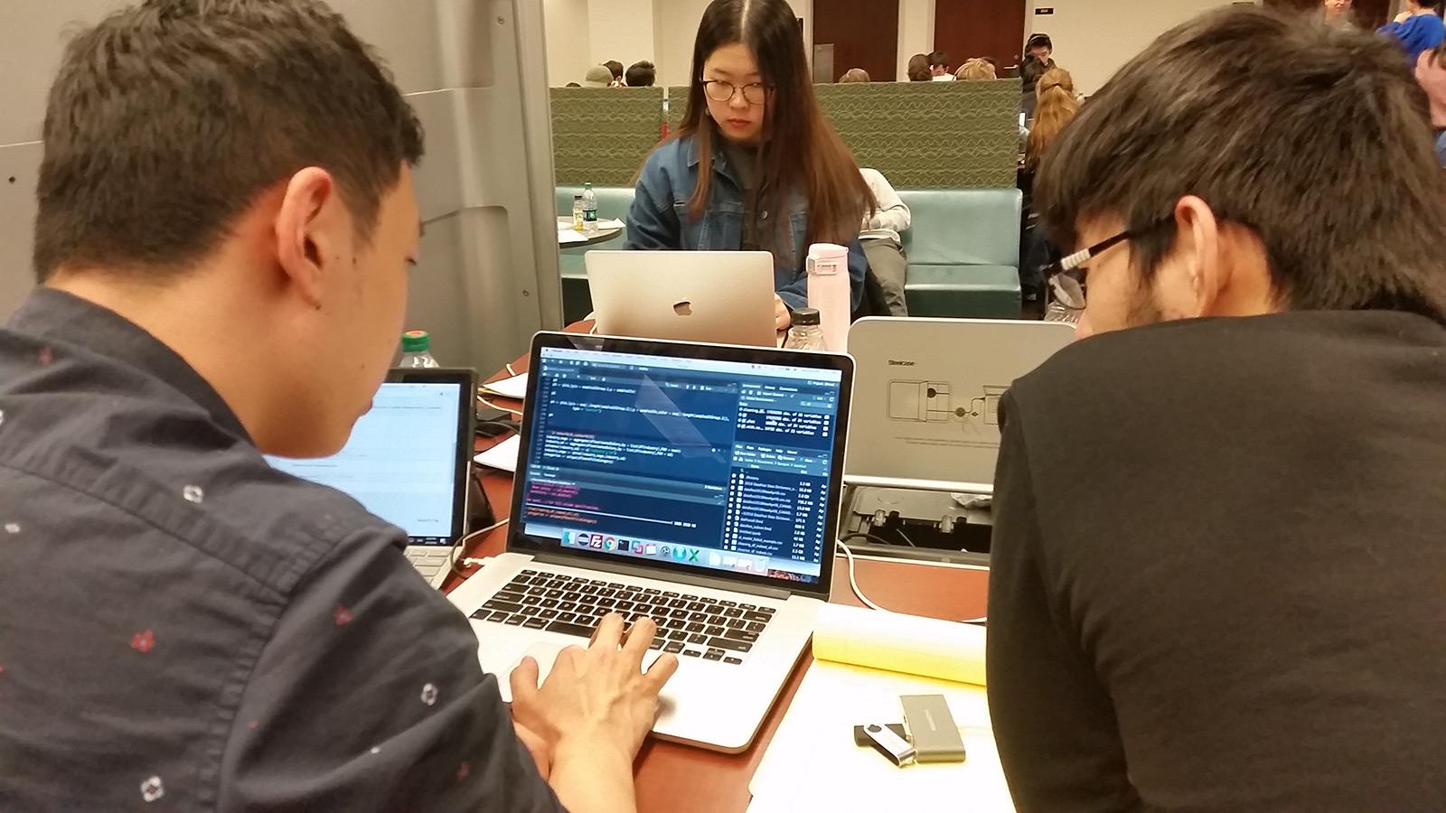 DataFest 2018 team working at a computer